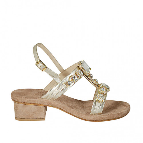 Woman's sandal in platinum laminated...