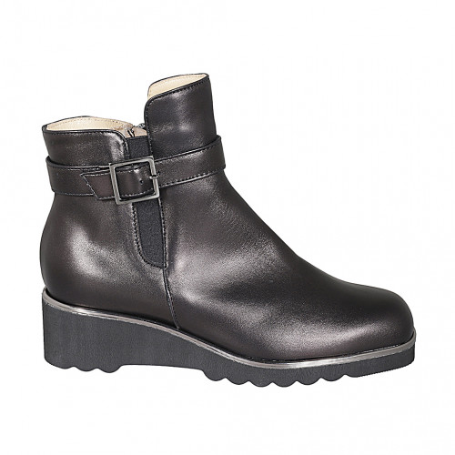 Woman's ankle boot with removable insole, elastic, buckle and zipper in black leather wedge heel 4 - Available sizes:  45