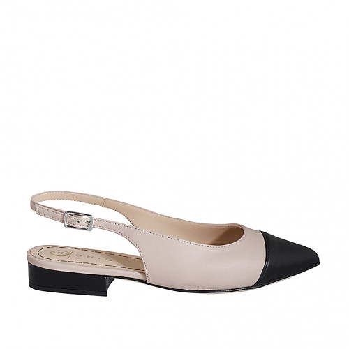 Woman's pointy slingback pump in nude...